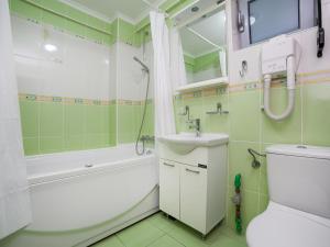 a bathroom with a sink toilet and a shower at Apartments Raymond in Sveti Stefan