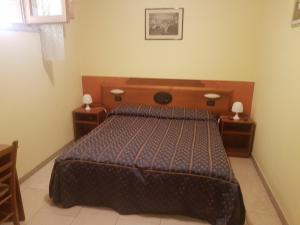 Postel nebo postele na pokoji v ubytování B&B Antica Trattoria