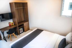 Uma cama ou camas num quarto em Robin Hotel Danang