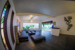 a living room with a couch and a table at Palaka Resort in General Luna