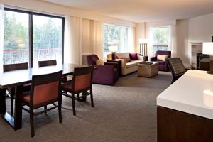 a room with a living room and a dining room at Crosswaters Resort at Kananaskis in Kananaskis Village