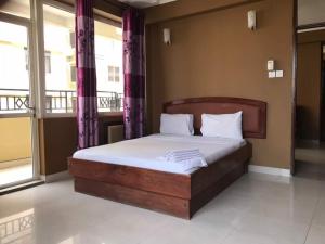 Iris Hotel Dar Es Salaam 객실 침대