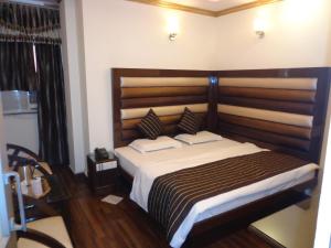 Postel nebo postele na pokoji v ubytování Hotel Lal's Haveli