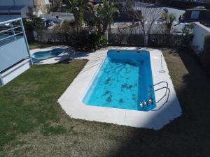 Der Swimmingpool an oder in der Nähe von Cozy Loft Torremolinos