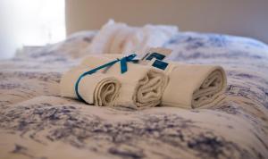 A bed or beds in a room at La Casa di Ilde al Duomo - Ortigia Holidays