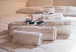 A bed or beds in a room at La Casa di Ilde al Duomo - Ortigia Holidays