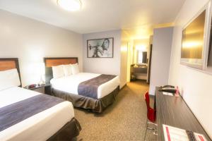 Kama o mga kama sa kuwarto sa Hotel Ruby