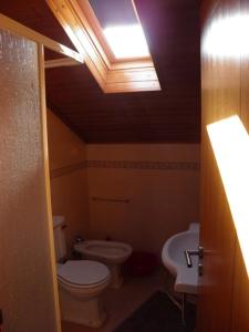 a bathroom with a toilet and a sink at Casa de São José in Sardoal