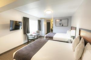 Kama o mga kama sa kuwarto sa Hotel Ruby