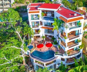 an aerial view of a building with a swimming pool at Villa Divina Luxury in Puerto Vallarta