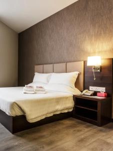 Postel nebo postele na pokoji v ubytování Hotel Trillium