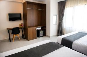Uma cama ou camas num quarto em Robin Hotel Danang