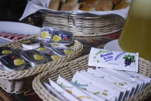 a table with two baskets of food and bread at Seven Machupicchu in Machu Picchu