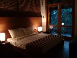 Letto o letti in una camera di Roshara Nalla