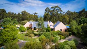 an aerial view of a house with trees at Parnella Kettering in Kettering