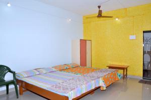 Postel nebo postele na pokoji v ubytování Hotel Anjali Lodge Malvan