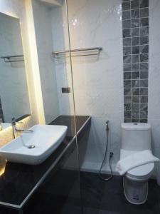 Koupelna v ubytování Samui City Hotel