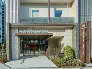 a building with an entrance to a building at Hearton Hotel Shinsaibashi Nagahoridouri in Osaka