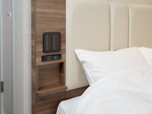 Letto o letti in una camera di Hearton Hotel Shinsaibashi Nagahoridouri