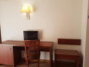 TV a/nebo společenská místnost v ubytování Hotel Mayna