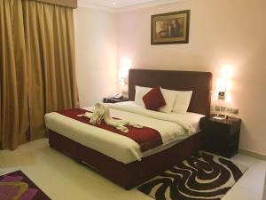 Voodi või voodid majutusasutuse Mirage Hotel Al Aqah toas