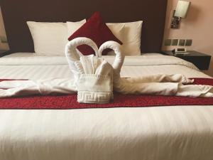 Voodi või voodid majutusasutuse Mirage Hotel Al Aqah toas