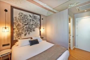 Posteľ alebo postele v izbe v ubytovaní Hostal Central Barcelona