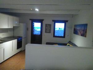 Kuchyň nebo kuchyňský kout v ubytování Loft La Tahonilla