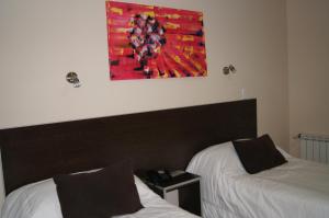 Una cama o camas en una habitación de Hotel Aire de Patagonia