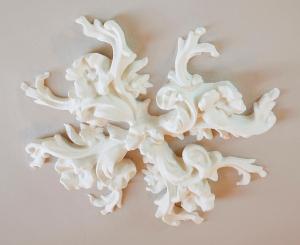 a white sculpture of a flower on a wall at Hostal Central Barcelona in Barcelona