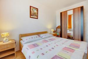 Postel nebo postele na pokoji v ubytování Apartman Dragica