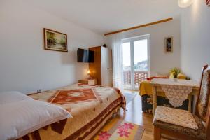 Postel nebo postele na pokoji v ubytování Apartman Dragica