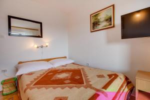 Postel nebo postele na pokoji v ubytování Apartman Dragica