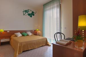 Postel nebo postele na pokoji v ubytování Mio Hotel Firenze