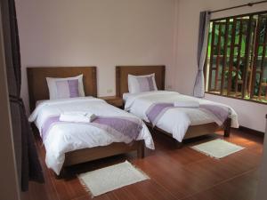 Кровать или кровати в номере Asiana House