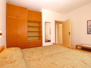 Postel nebo postele na pokoji v ubytování Apartment Giovanna 1557