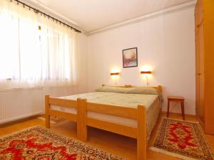 Postel nebo postele na pokoji v ubytování Apartment Giovanna 1557