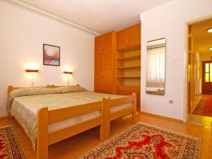 Postel nebo postele na pokoji v ubytování Apartment Giovanna 1557