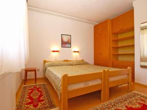 Postel nebo postele na pokoji v ubytování Apartment Giovanna 1557