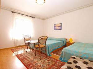 Postel nebo postele na pokoji v ubytování Apartment Giovanna 1557