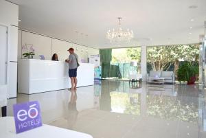 a man standing at a counter in a house at eó Suite Hotel Jardin Dorado in Maspalomas