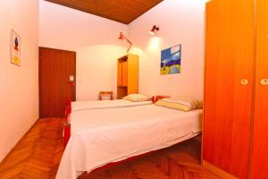 Postel nebo postele na pokoji v ubytování Apartment Milena 1560