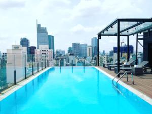 a large swimming pool on the roof of a building at Bay Hotel Ho Chi Minh in Ho Chi Minh City