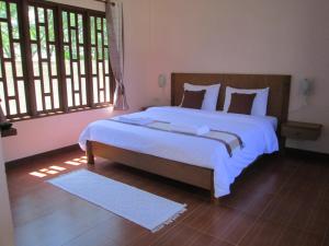 Кровать или кровати в номере Asiana House