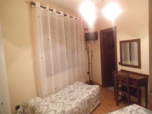 Posteľ alebo postele v izbe v ubytovaní Hostal Los Galgos