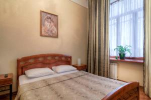 Кровать или кровати в номере Mini Hotel City On Nevsky