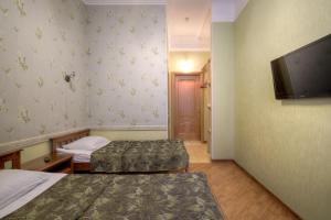 Кровать или кровати в номере Mini Hotel City On Nevsky