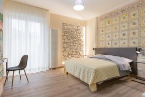 Postel nebo postele na pokoji v ubytování Domus Fluminis