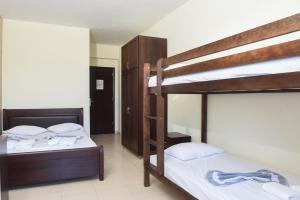 Postel nebo postele na pokoji v ubytování Hotel Paris