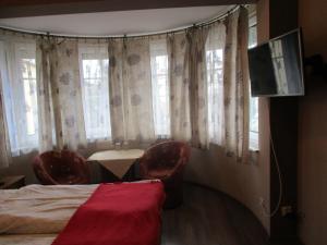 Łóżko lub łóżka w pokoju w obiekcie Hotel Pod Platanami